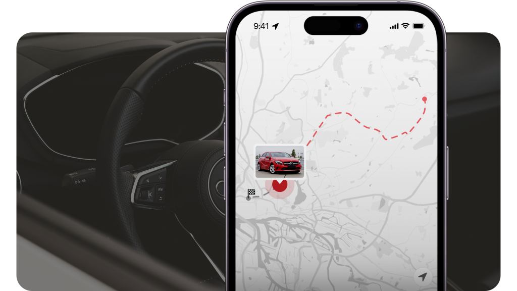 Smartphone zeigt Routenkarte einer Fahrzeugüberführung neben Autoinnenraum